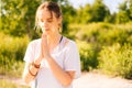 Close-up portrait of face of relaxed young woman is meditating in lotus position with closed eyes. Royalty Free Stock Photo