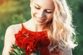 Close-up portrait of fashion beautiful smiling woman with red fl Royalty Free Stock Photo