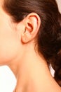 A close-up portrait of a female ear and neck Royalty Free Stock Photo