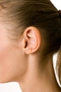 A close-up portrait of a female ear and neck Royalty Free Stock Photo