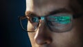 Close-up portrait of focused software engineer wearing eyeglasses Royalty Free Stock Photo