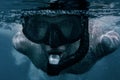 Close-up underwater portrait of freediver man.