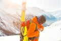 A close-up portrait of a freeride skier on the climbing track for freeride-descent.