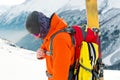 A close-up portrait of a freeride skier on the climbing track for freeride-descent.