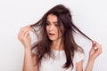 Close up portrait of frustrated young brunette woman with messed Royalty Free Stock Photo