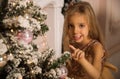 Close up. Portrait of a fun smilling little girl near by Christmas tree. Christmas concept Royalty Free Stock Photo