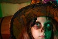 Close up portrait of funny girl child wearing Halloween costume on home Halloween decorated background. Big eyes with Royalty Free Stock Photo