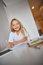 Elegant smiling small female in white shirt enjoying weekend in home Royalty Free Stock Photo