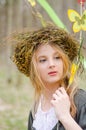 Close up portrait of a girl in a folk circlet of flowers Royalty Free Stock Photo