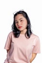 Close up portrait of gorgeous Asian woman casual t-shirt standing and looking at camera with confidence Royalty Free Stock Photo