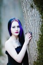 Close-up portrait of the gothic woman in the dark forest Royalty Free Stock Photo