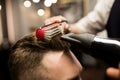 Hairdresser styling customer hair