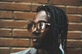 Close-up portrait of a handsome African-American man with outdoor sunglasses Royalty Free Stock Photo