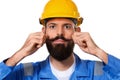 Close up portrait of handsome bearded builder in hard hat, foreman or repairman in the helmet playing with his moustache