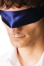 Close-up portrait of a handsome blindfold man