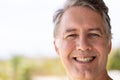 Close-up portrait of handsome caucasian senior man smiling and looking at camera, copy space Royalty Free Stock Photo