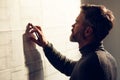 Close-up portrait of handsome man concentrated on work. Architect working in office with blueprints. Engineer sketching Royalty Free Stock Photo