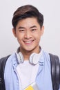 Close up portrait of a handsome young asian man smiling on isolated white background Royalty Free Stock Photo