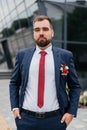 Close-up portrait of handsome young bridegroom with elegant stylish haircut