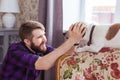 Close Up portrait handsome young hipster man plays and loves his good friend dog at home. Positive human emotions Royalty Free Stock Photo