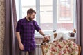 Close Up portrait handsome young hipster man plays and loves his good friend dog at home. Positive human emotions Royalty Free Stock Photo
