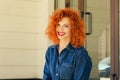 Close-up portrait of a happy beautiful red-headed girl. Wonderful smiling woman with lovely look bright make up. Natural young Royalty Free Stock Photo