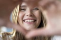 Close up portrait happy beautiful woman showing heart symbol Royalty Free Stock Photo