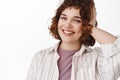 Close up portrait of happy candid girl with relaxed pose, cheerful white smile and stylish curly short hairstyle Royalty Free Stock Photo