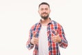 Close up portrait of a happy casual man showing thumbs up gesture over white background