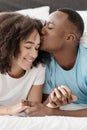 Close-up portrait of happy couple lying in bed together, enjoy each other company and free time Royalty Free Stock Photo