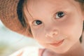 Close up portrait of happy cute little girl in hat in a summer day Royalty Free Stock Photo