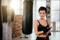 Close up portrait of happy female with short haircut in workout