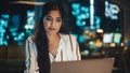 Close Up Portrait of a Happy Indian Manager Sitting at a Desk in Creative Office. Young Stylish Royalty Free Stock Photo