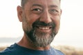 Close up portrait of happy man cheerful looking on camera. One adult mature male caucasian smile with confident and serene Royalty Free Stock Photo