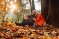 Close up portrait of a happy old woman and man in a park in autumn foliage Royalty Free Stock Photo