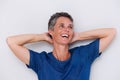 Close up happy older woman smiling with hands behind head Royalty Free Stock Photo