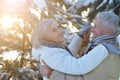 Happy senior couple dancing at snowy winter park Royalty Free Stock Photo