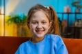 Portrait of happy smiling Caucasian preteen school girl child kid looking at camera, home play room Royalty Free Stock Photo