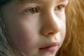 Close up portrait of happy smiling little girl with beautiful thick hair Royalty Free Stock Photo