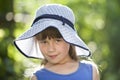 Close-up portrait of happy smiling little girl in a big hat. Child having fun time outdoors in summer Royalty Free Stock Photo