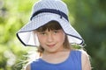 Close-up portrait of happy smiling little girl in a big hat. Child having fun time outdoors in summer Royalty Free Stock Photo