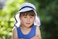 Close-up portrait of happy smiling little girl in a big hat. Child having fun time outdoors in summer Royalty Free Stock Photo