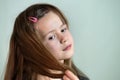 Close-up portrait of happy smiling little girl with long hair Royalty Free Stock Photo