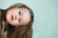 Close-up portrait of happy smiling little girl with long hair Royalty Free Stock Photo