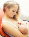 Portrait of happy smiling mother feeding breast her baby Royalty Free Stock Photo