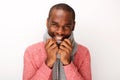 Close up happy young african american guy laughing with scarf against white background Royalty Free Stock Photo