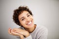 Close up portrait happy young african american woman smiling against against white wall Royalty Free Stock Photo