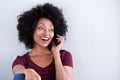 Happy young african woman talking on cell phone Royalty Free Stock Photo