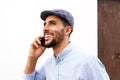 Close up happy young arabic man talking on mobile phone Royalty Free Stock Photo