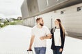 Close up portrait of happy young couple, man and woman go to the airport with a suitcase Royalty Free Stock Photo